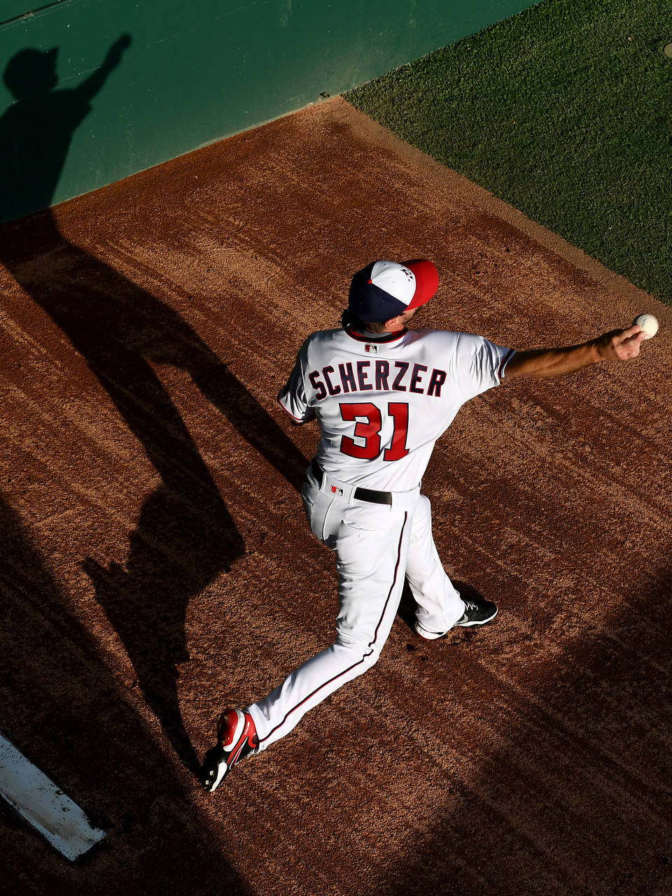 Max Scherzer At A Baseball Field Background