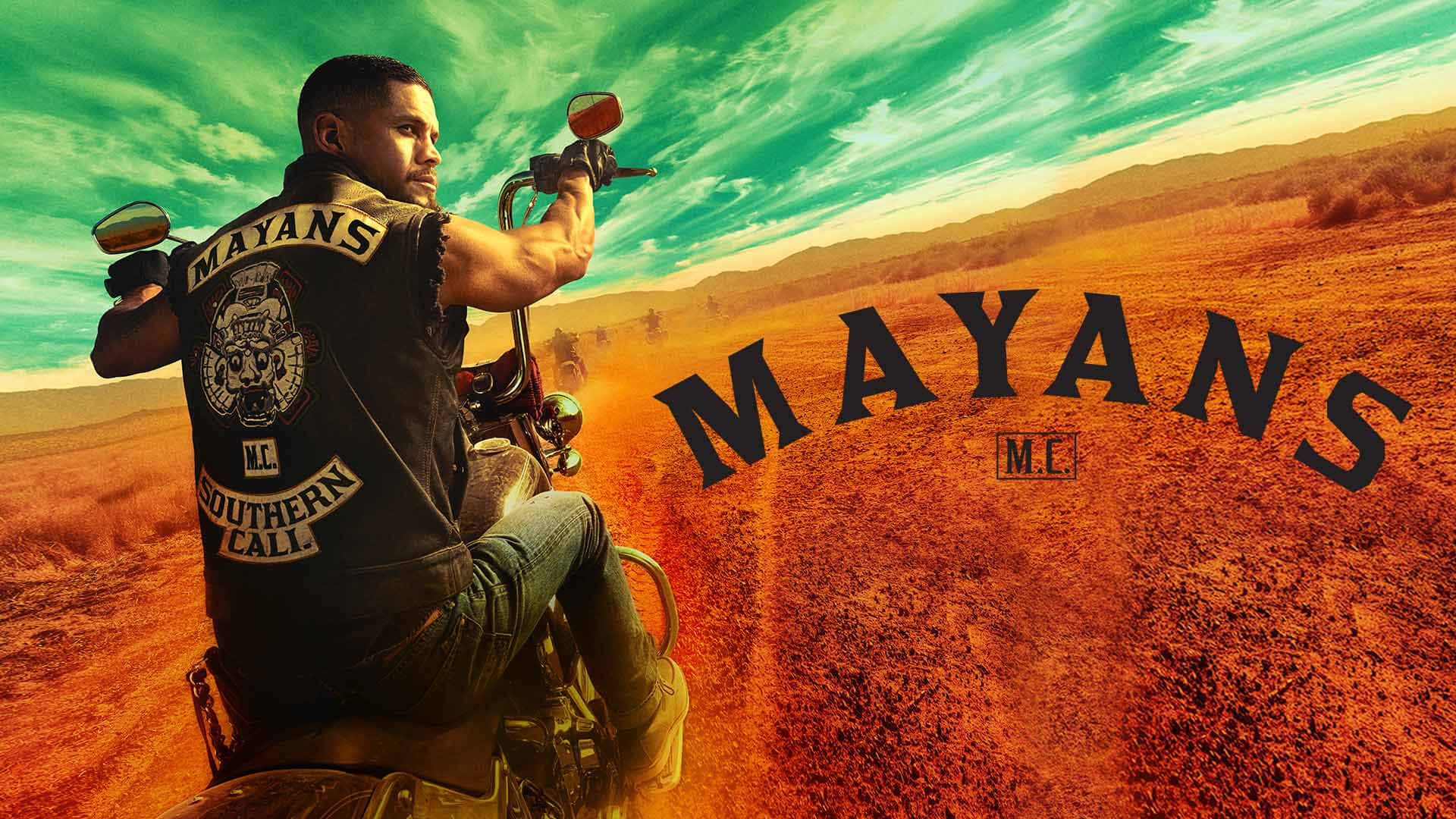 Mayans - A Man Riding A Motorcycle In The Desert Background