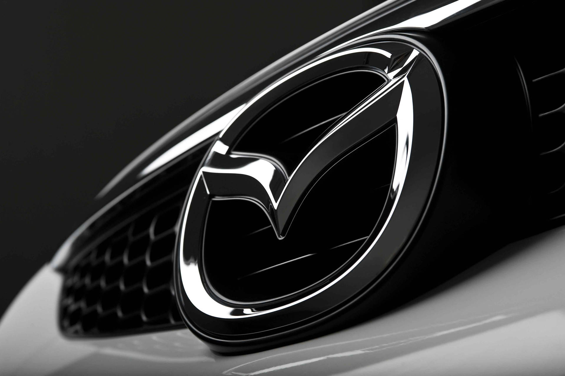 Mazda Car Grilles Logo Background