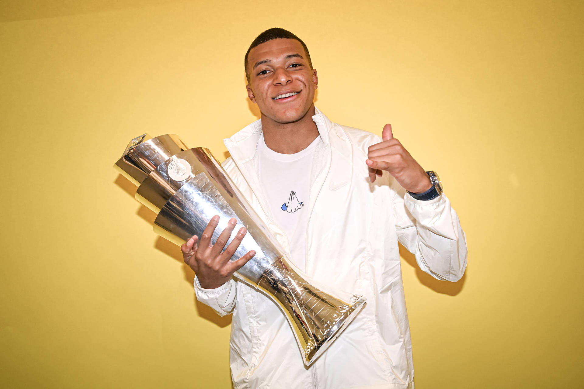 Mbappe With Uefa Trophy Background