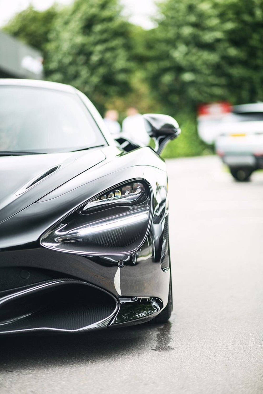 Mclaren 720s Phone Shiny Car On Road Background