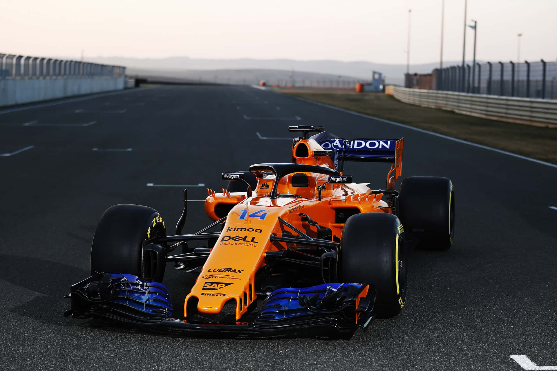 Mclaren Formula 1 Racing Team Revving Up For The Season Ahead Background