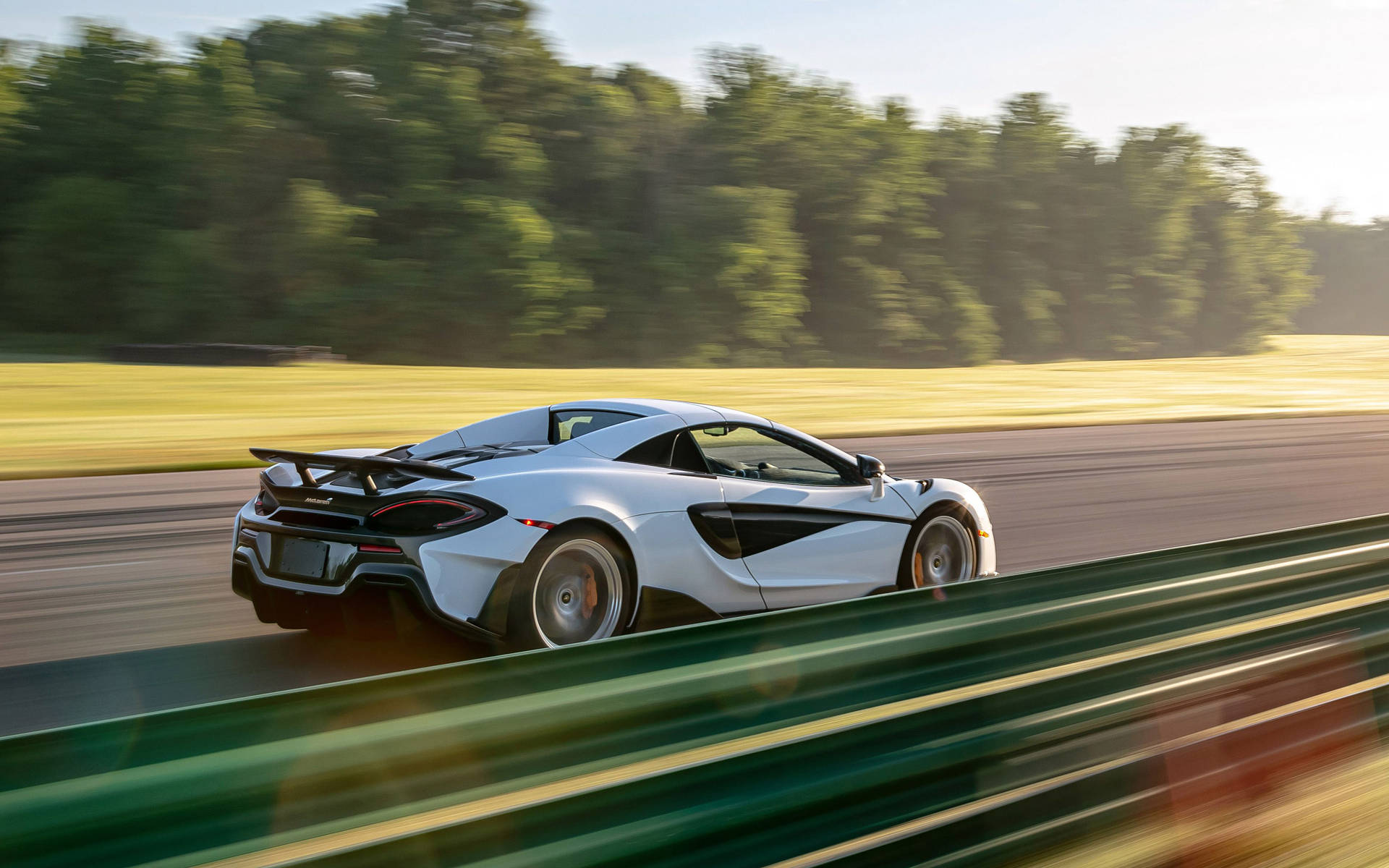 Mclaren Spyder Racing At Track Background