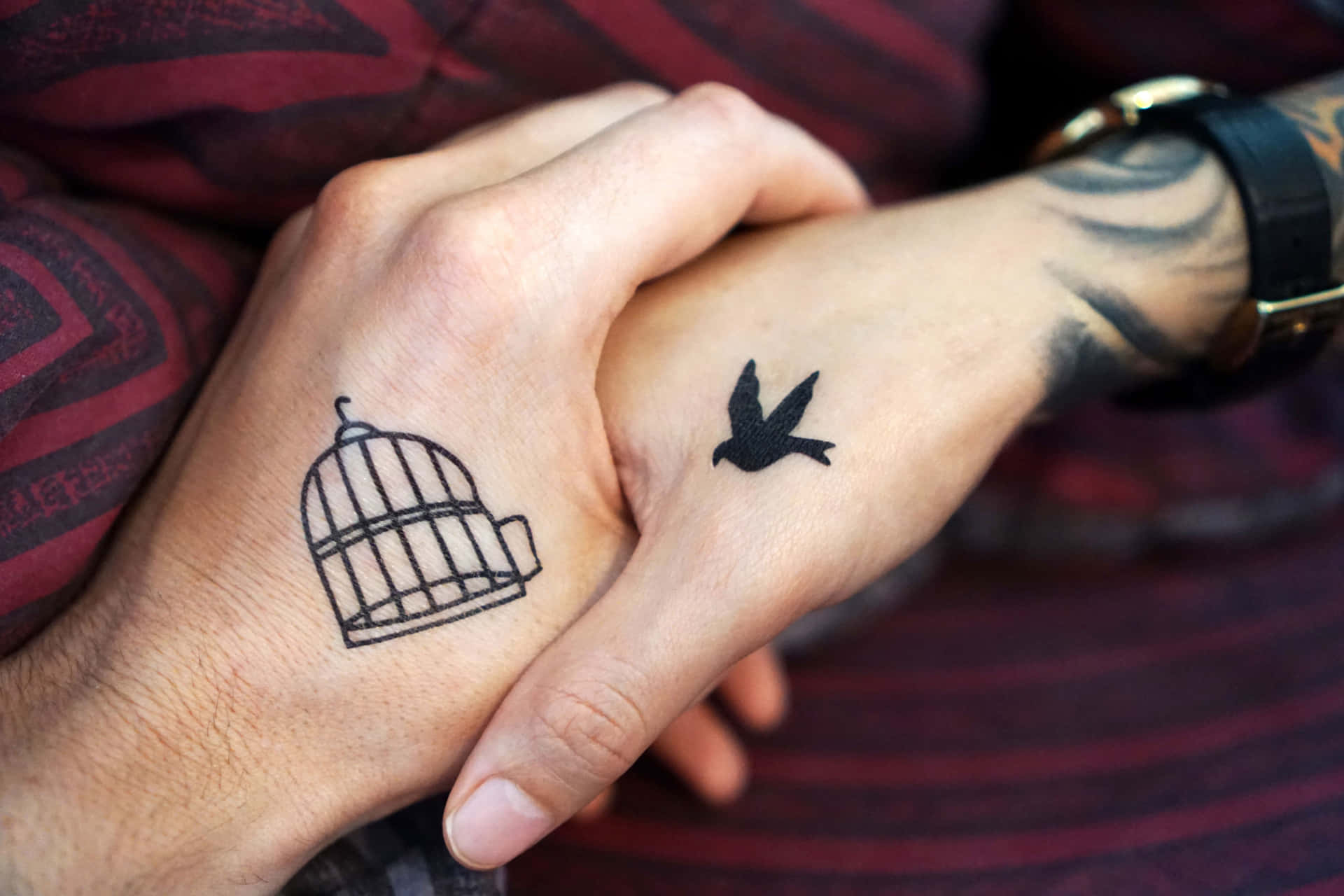 Meaningful Couple Hand Tattoo In Black Background