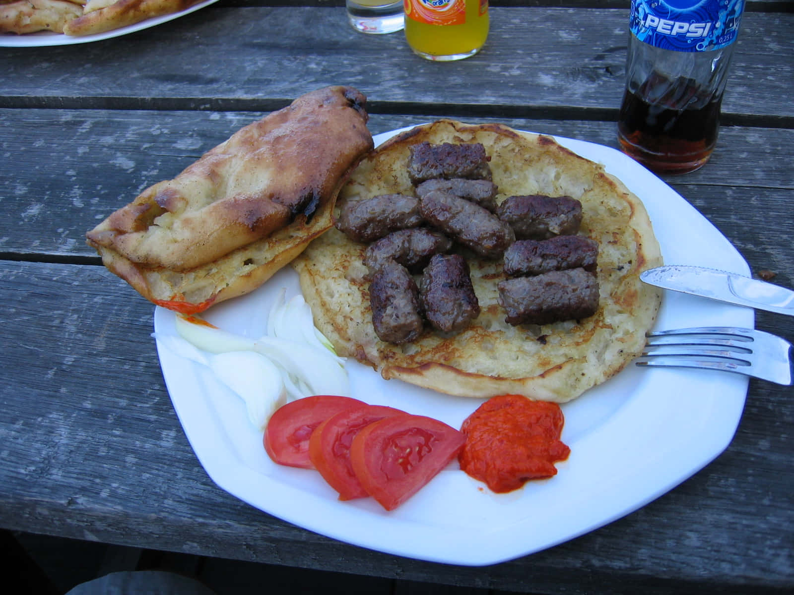 Meaty Ćevapi Sausages With Tomato Slices Background