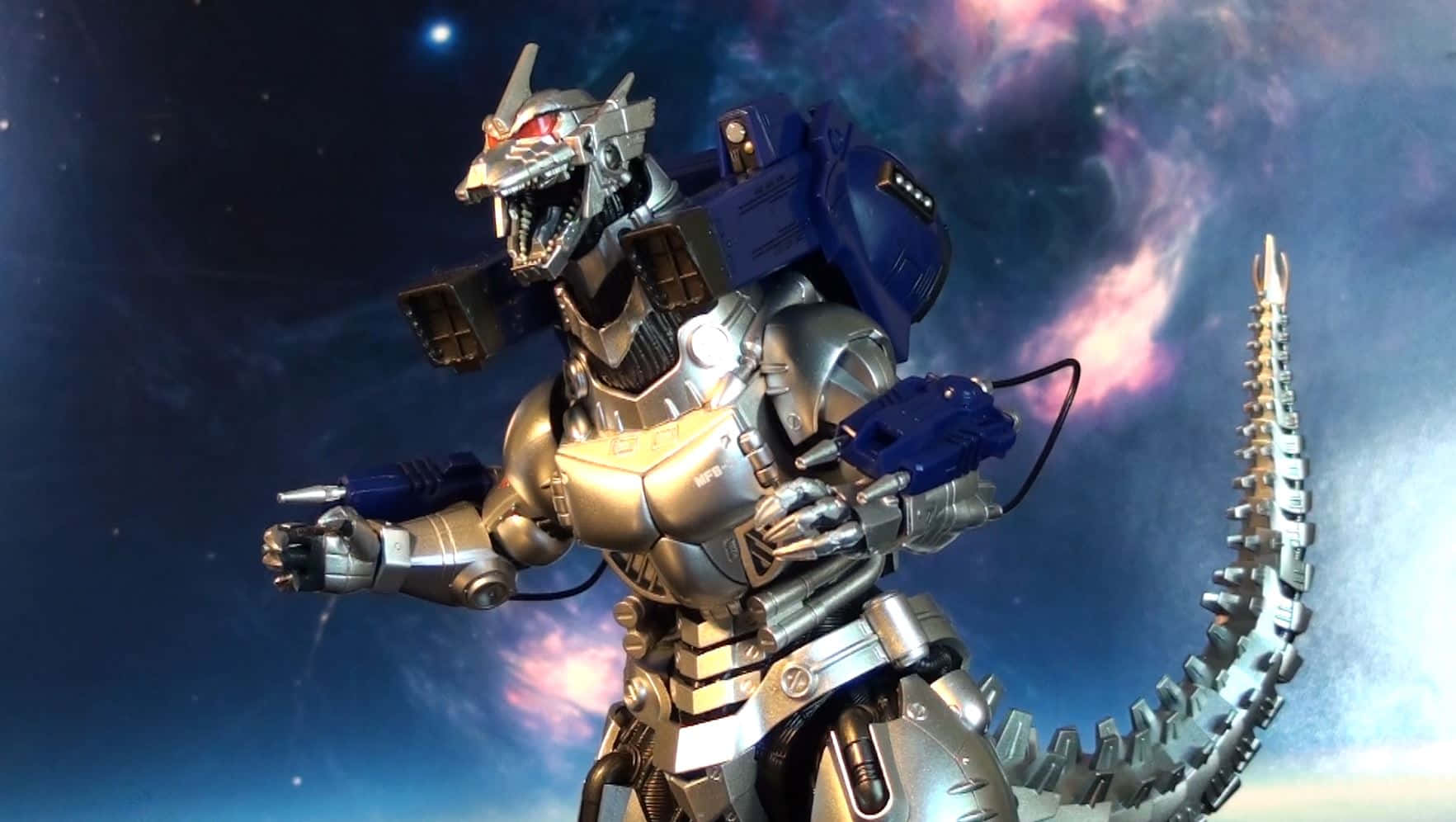 Mechagodzilla In All Its Metallic Glory On A Battlefield Background