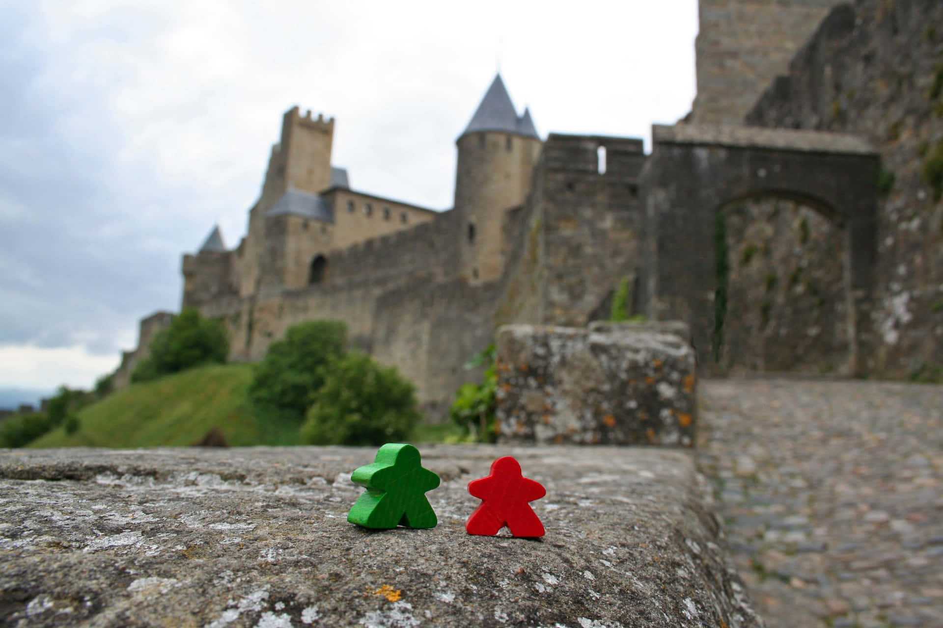 Meeples Outside The Castle In Carcassonne France Background
