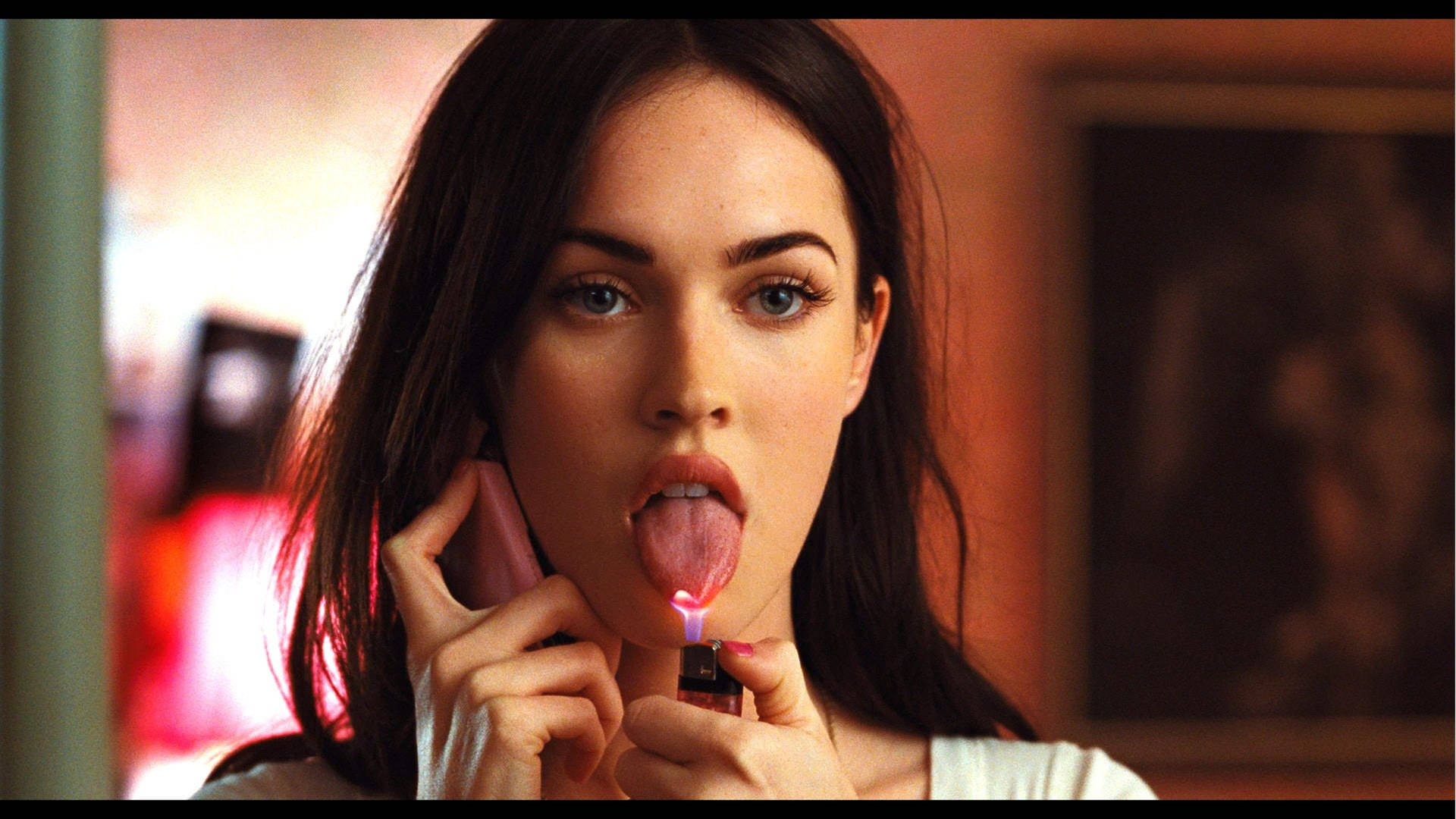 Megan Fox Sticks Out Her Tongue In A Sultry Pose.