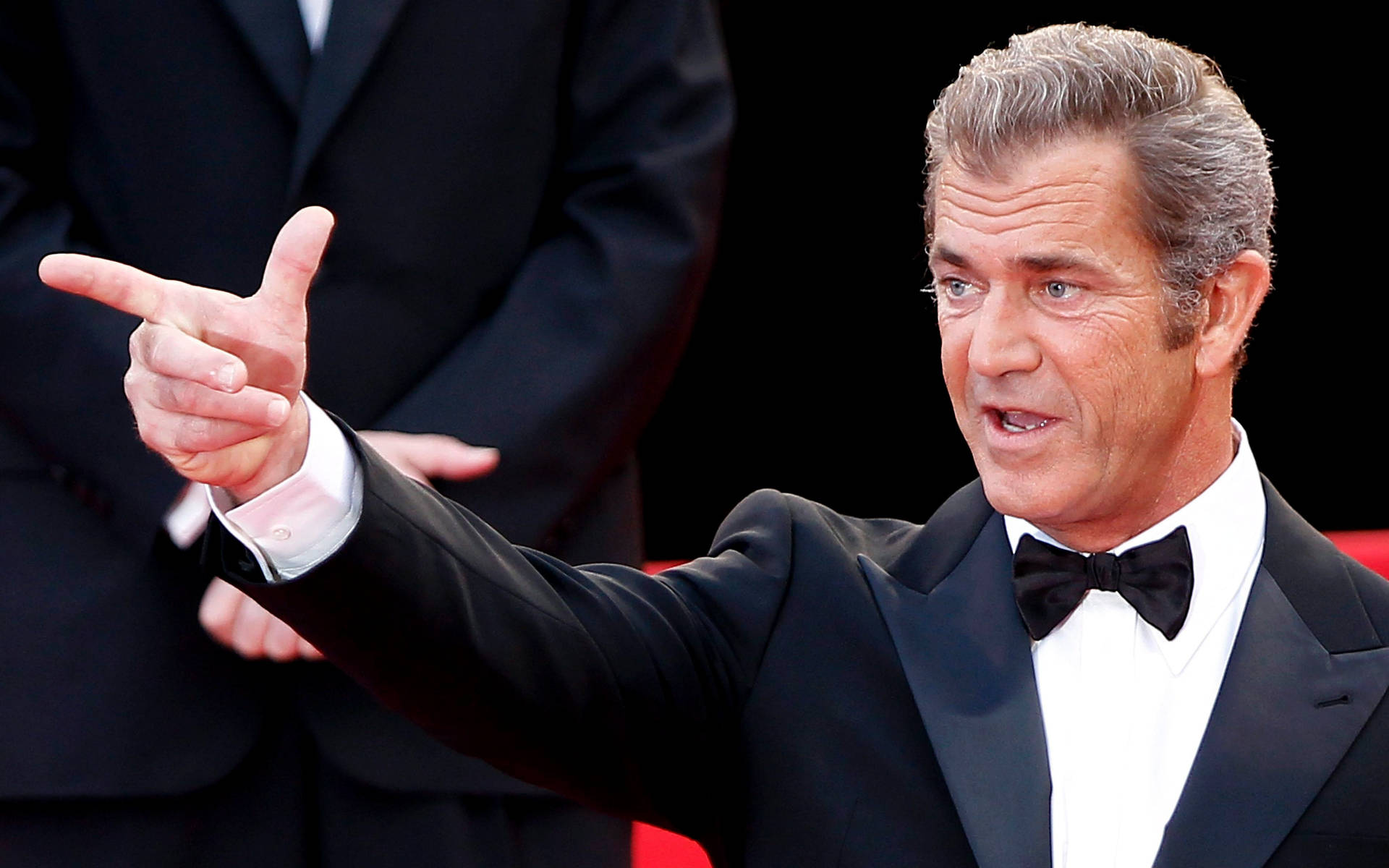 Mel Gibson Check Hand Sign Background