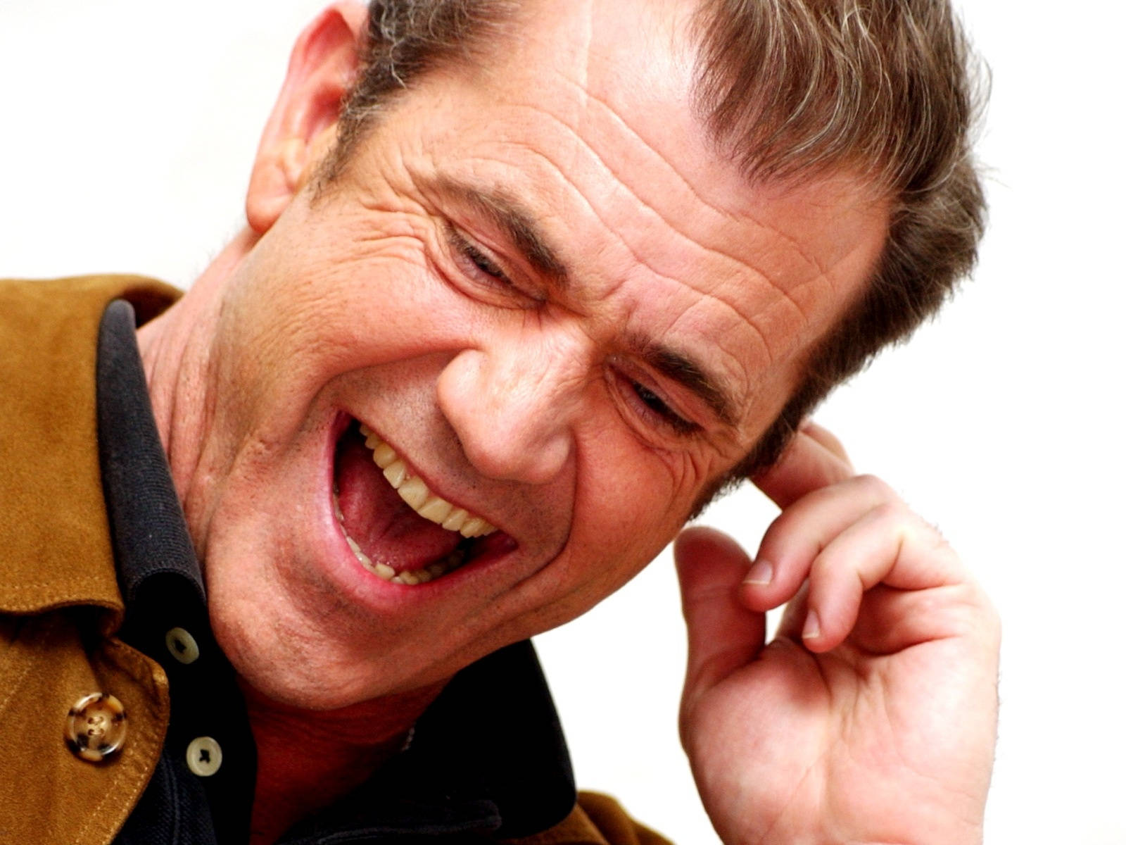 Mel Gibson Laughing Hard Background