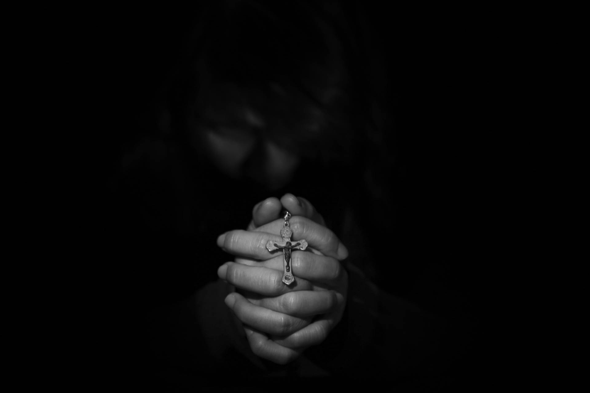 Melancholy Hands Holding Rosary Background