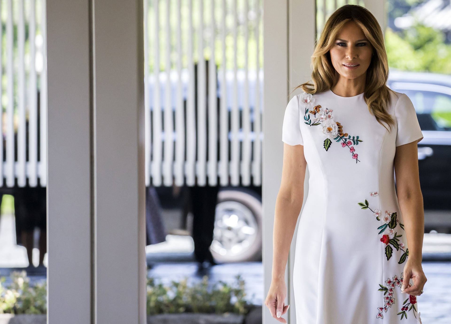 Melania Trump White Floral Dress Background