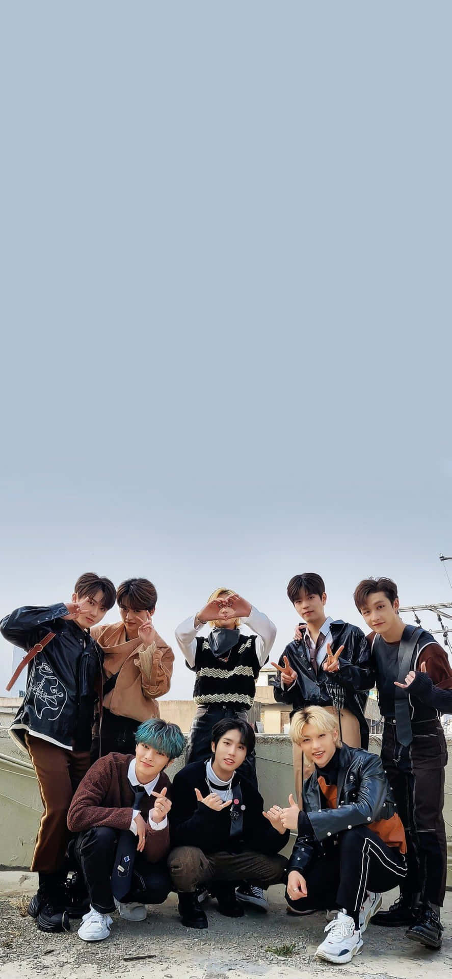 Members Of South Korean Pop Group Stray Kids Strike A Pose In Tech-inspired Outfits For Their 2020 Promotional Photo Shoot. Background