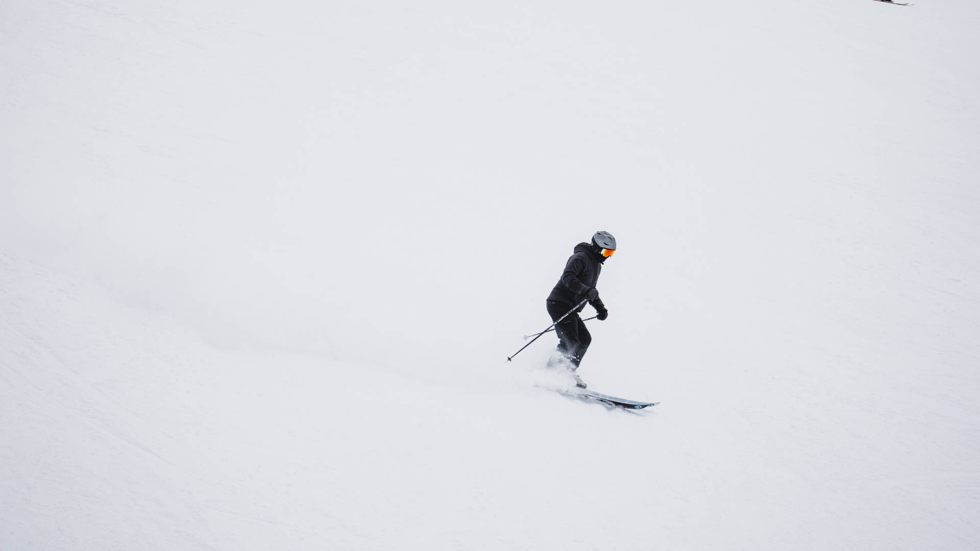 Men In Black Skiing Background