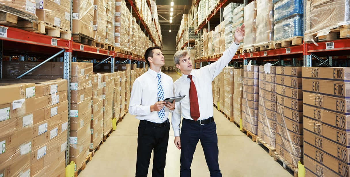 Men In Executive Attires Assessing The Wholesale Products