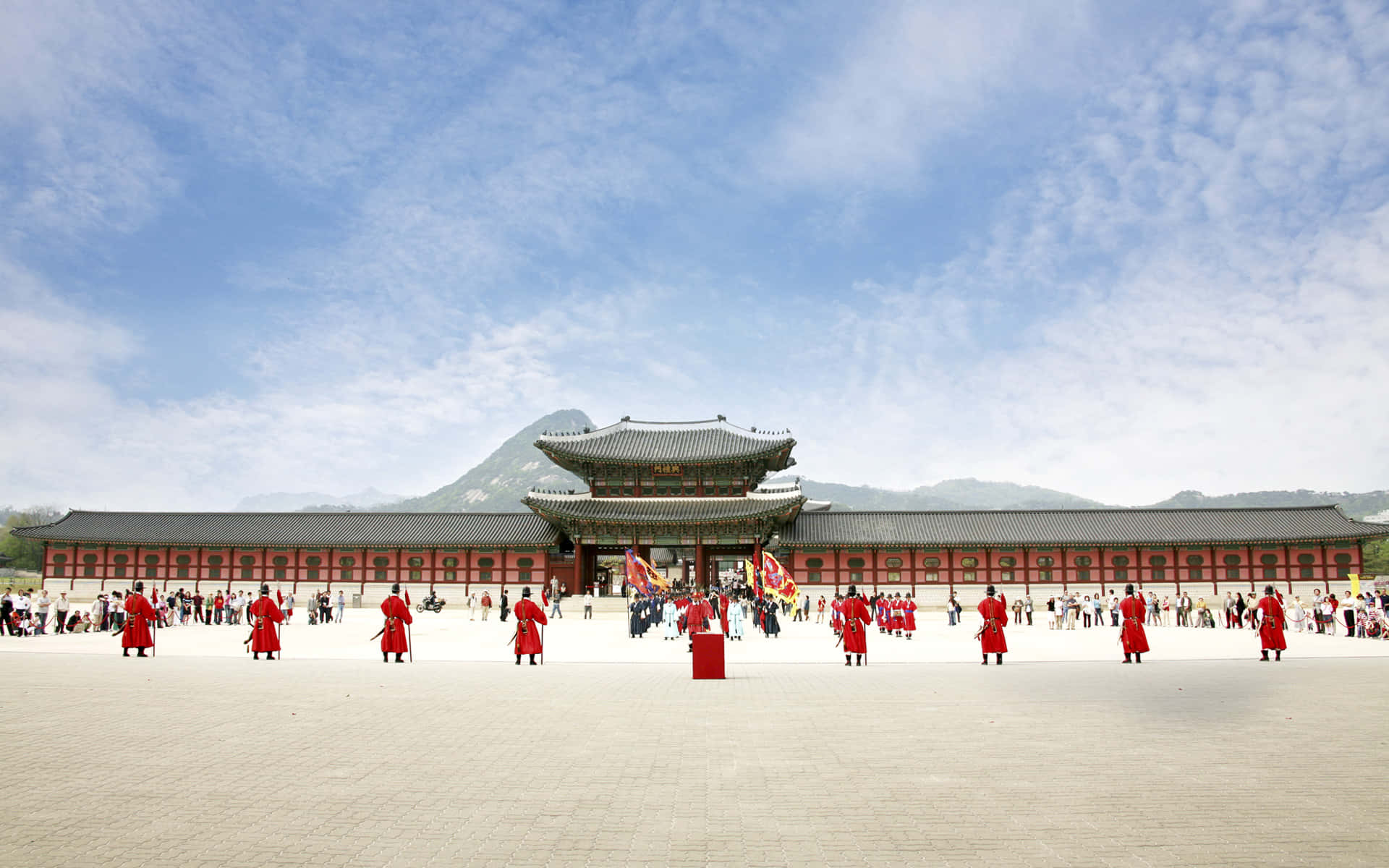 Men In Red At Gyeongbokgung Palace Background