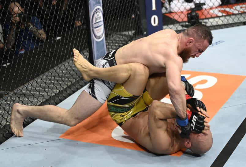 Merab Dvalishvili Tackling Opponent Background