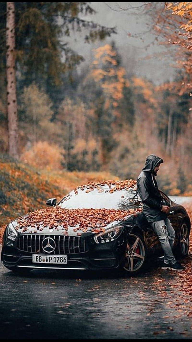 Mercedes Benz Car Covered In Leaves Background