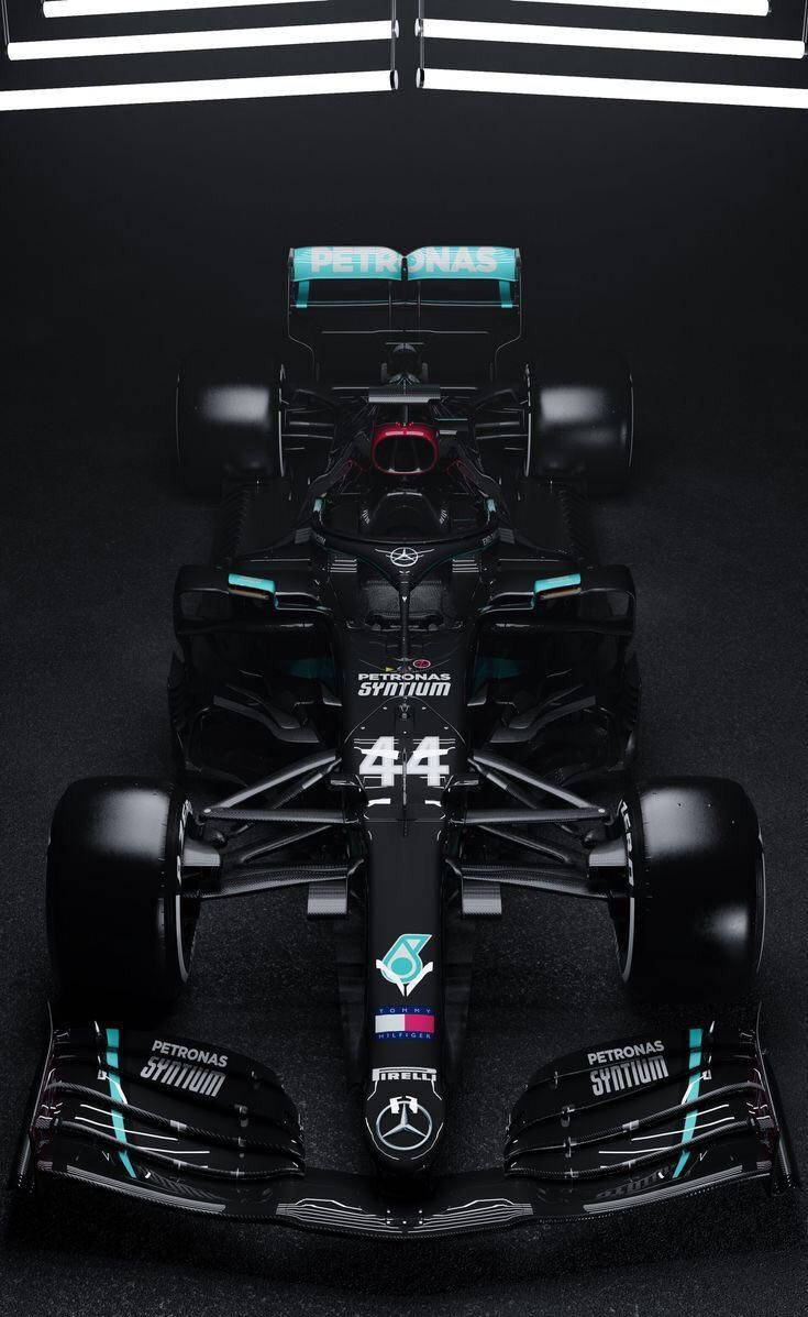 Mercedes F1 Car In A Dark Room Background