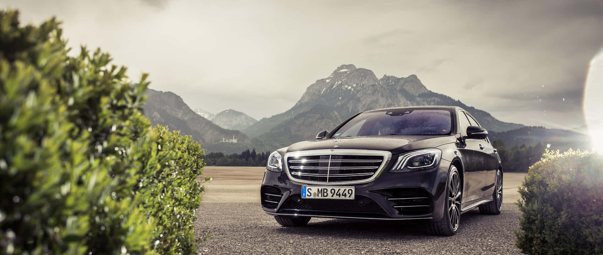 Mercedes S-class Parked In Front Of Mountains