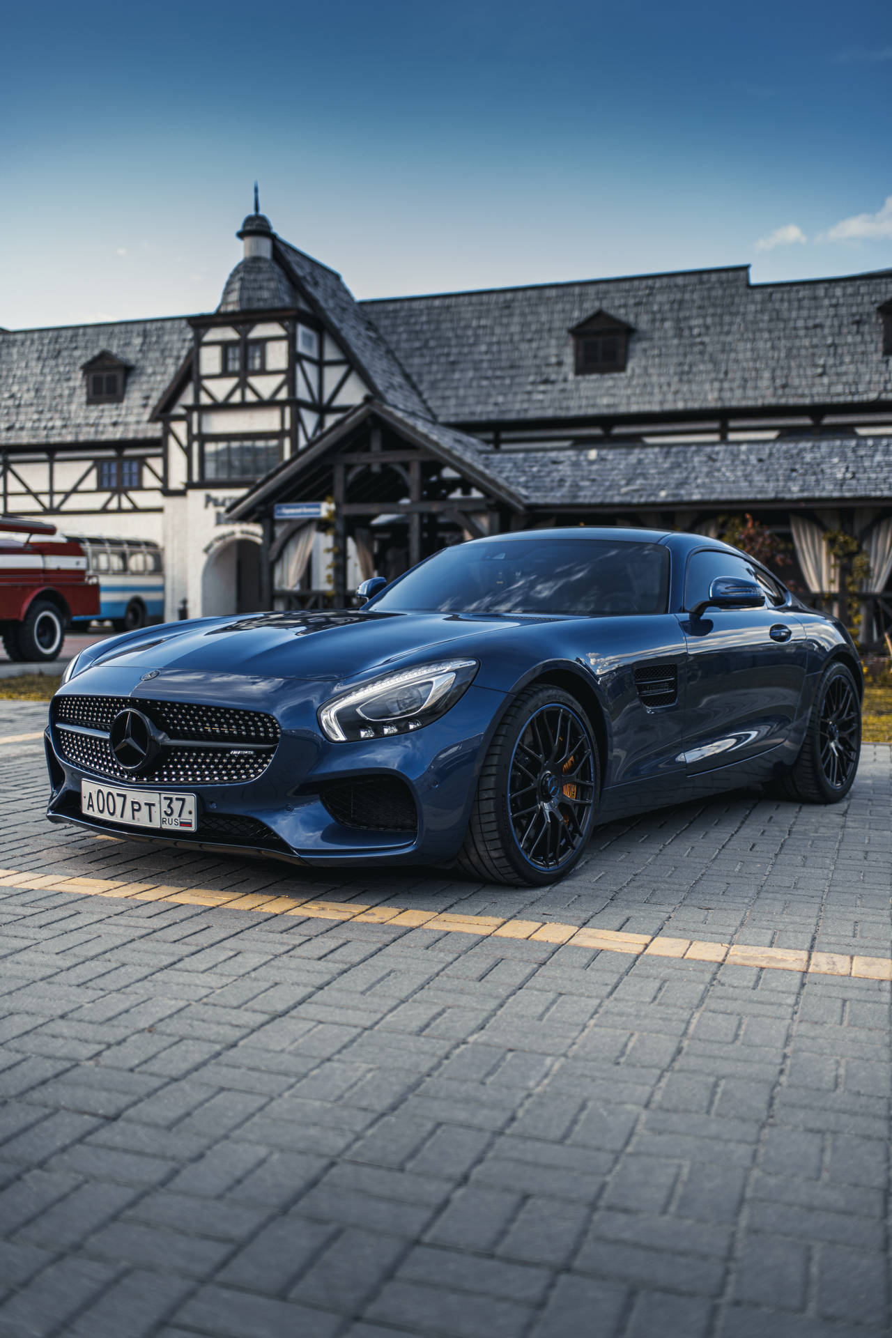 Mercedes Sls Gt Parked In Front Of A House Background