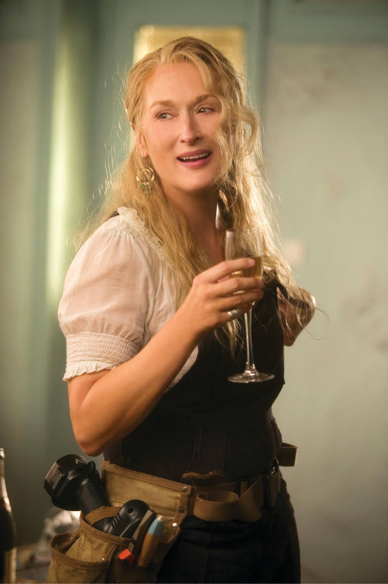 Meryl Streep Holding A Champagne Glass Background