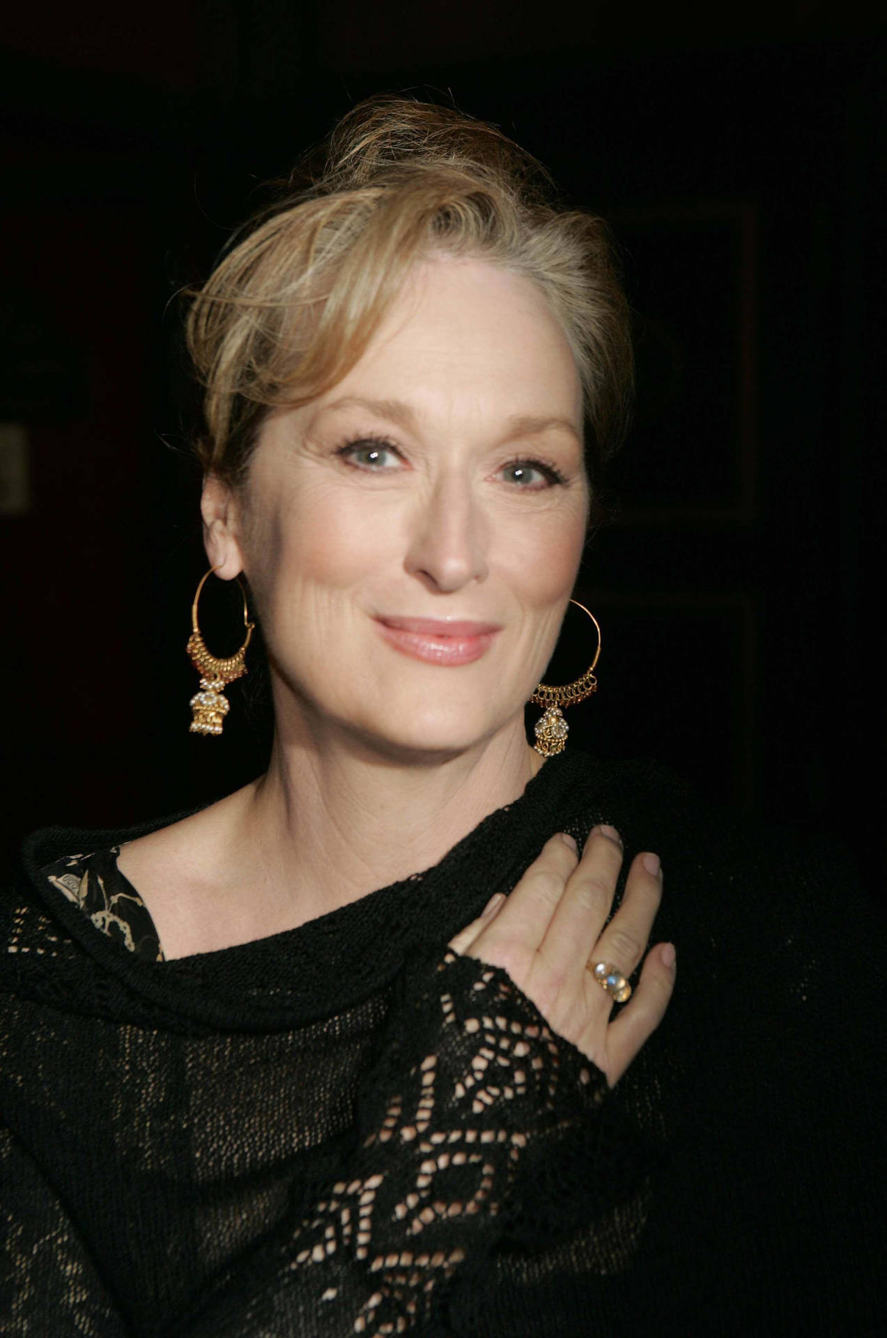 Meryl Streep In A Black Setting Background