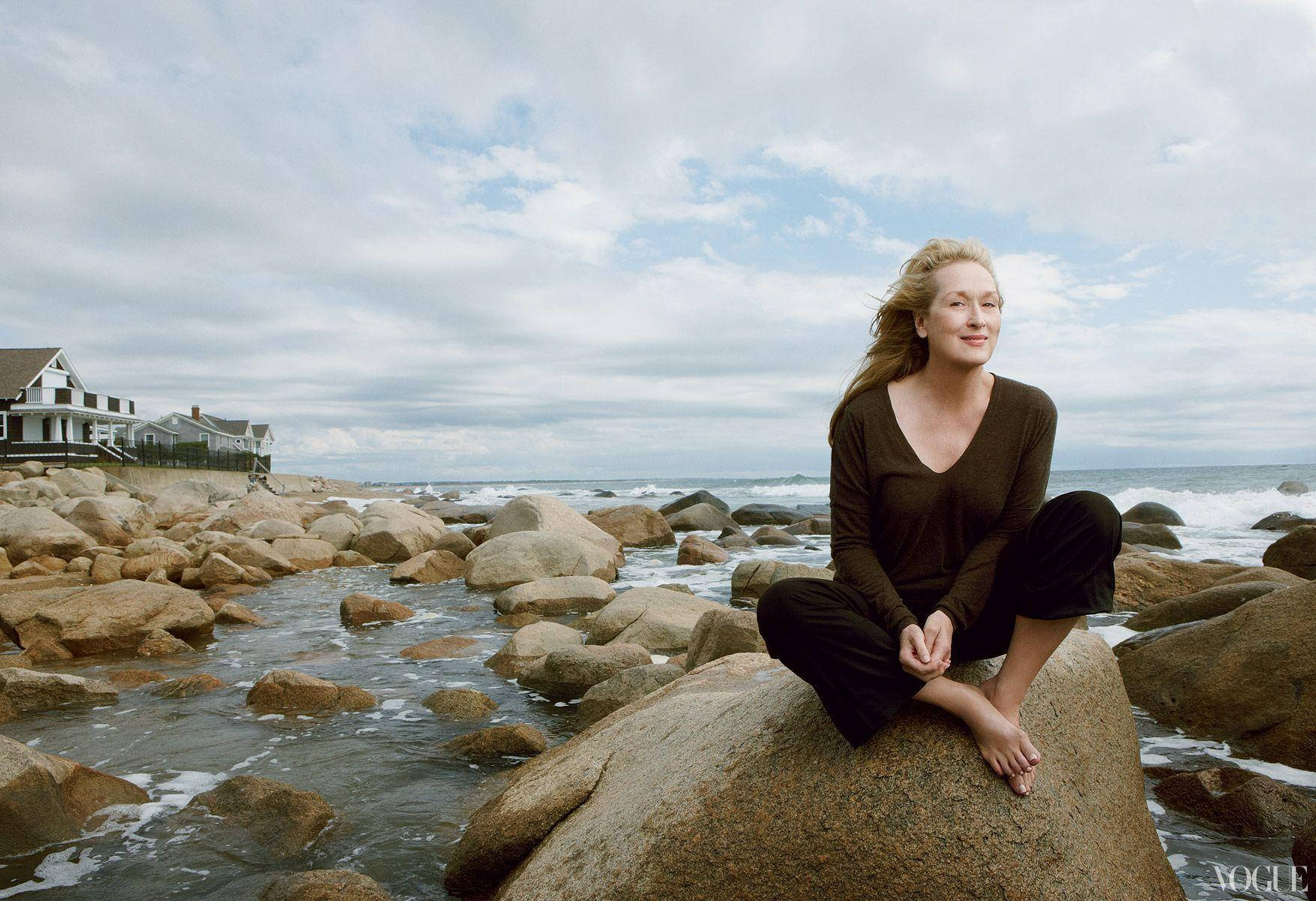 Meryl Streep On A Rocky Beach Background