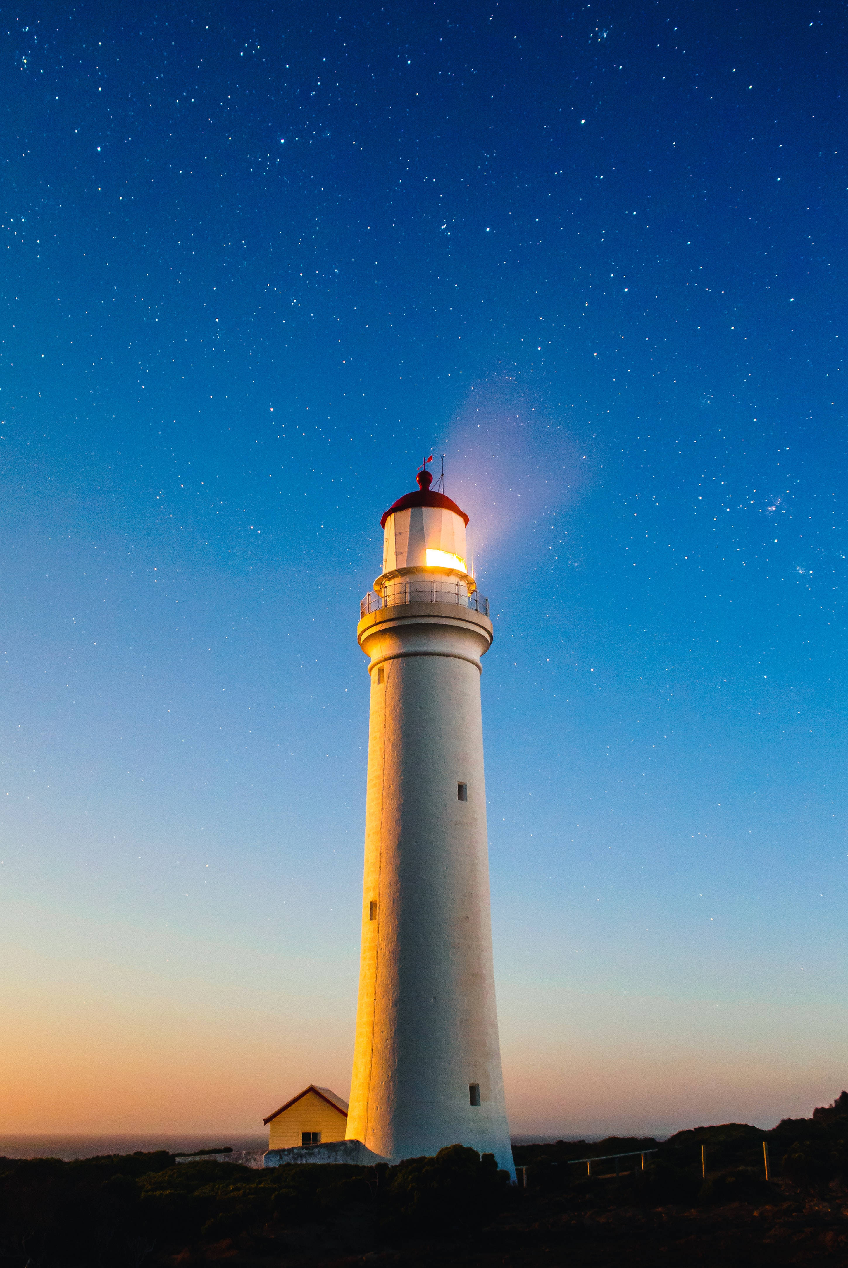 Mesmerizing 4k Ultra Hd Phone Wallpaper Of A Lighthouse Under The Blue Sky Background