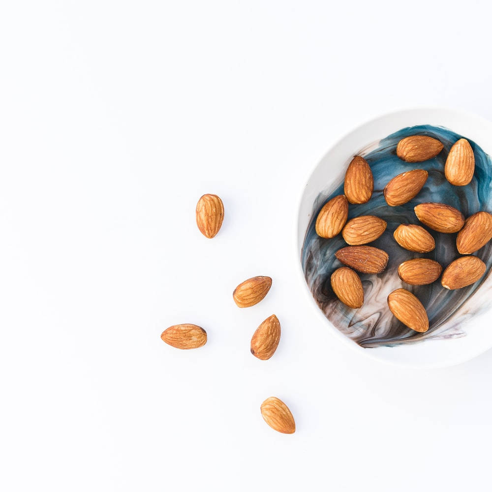 Mesmerizing Almonds In Spiralled Arrangement Background