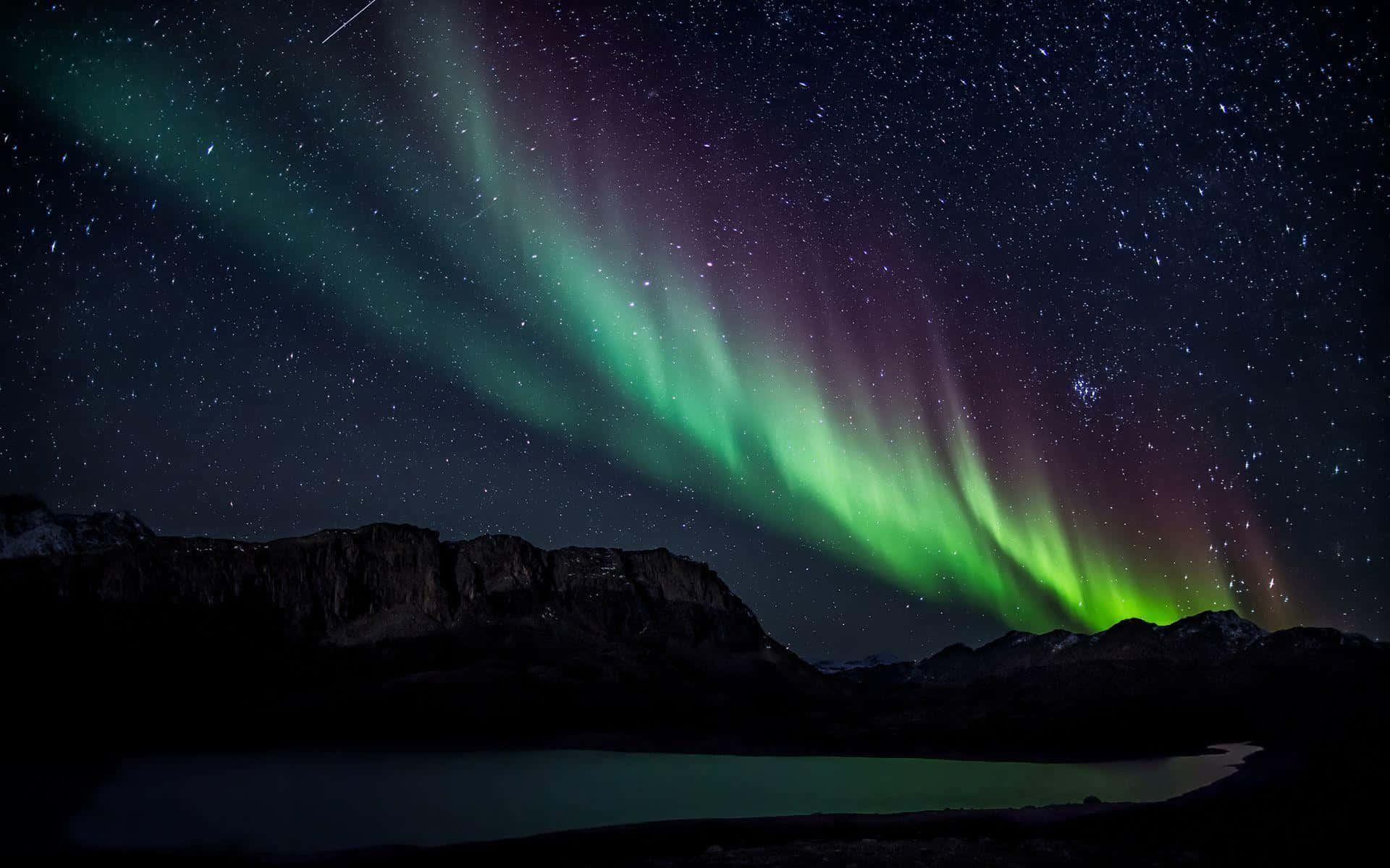 Mesmerizing Aurora Borealis Dancing In The Night Sky Background