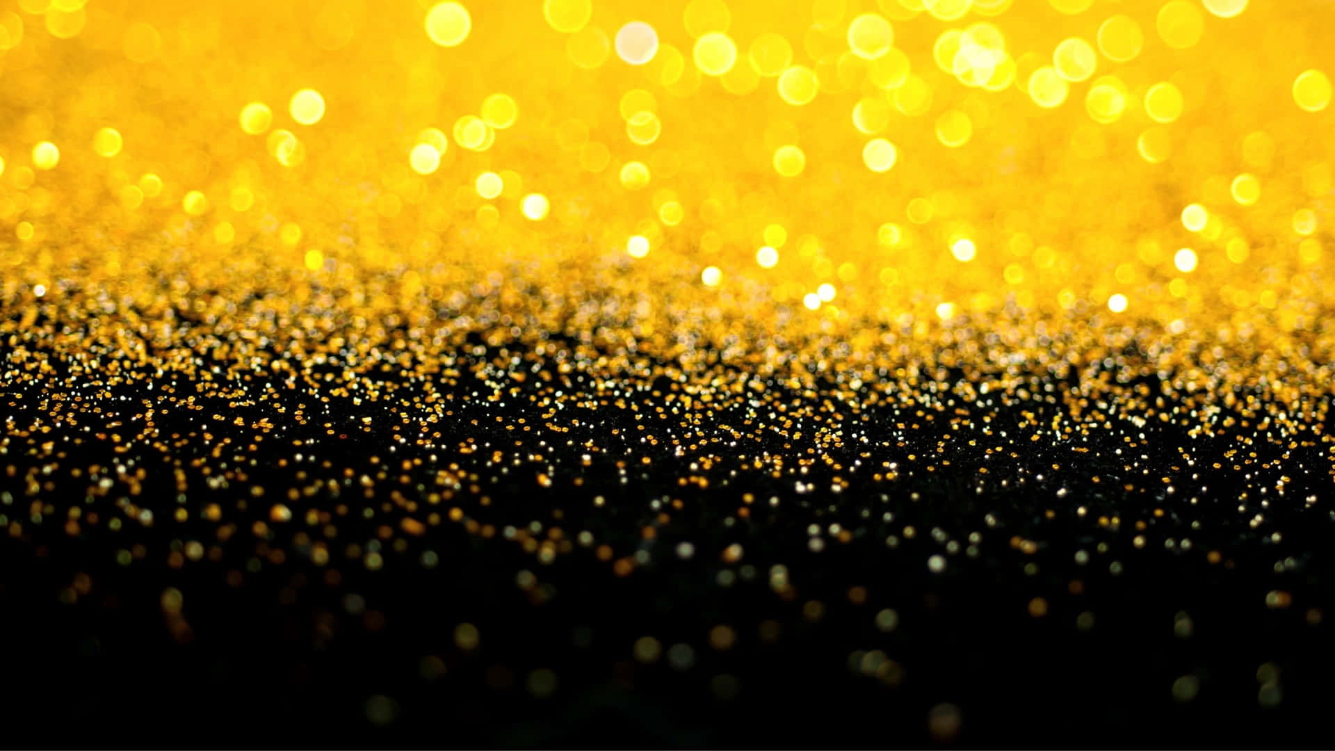 Mesmerizing Black And Gold Glitter Wallpaper Background