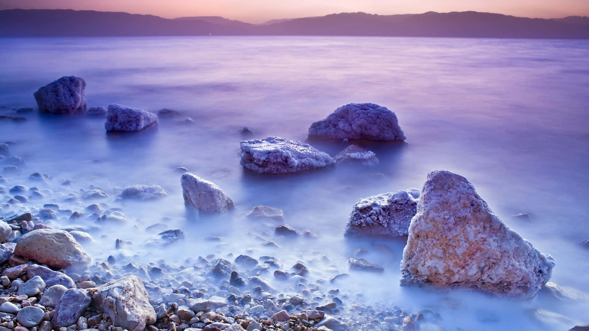 Mesmerizing Salt Formation Cloaked In Mist At The Dead Sea Background