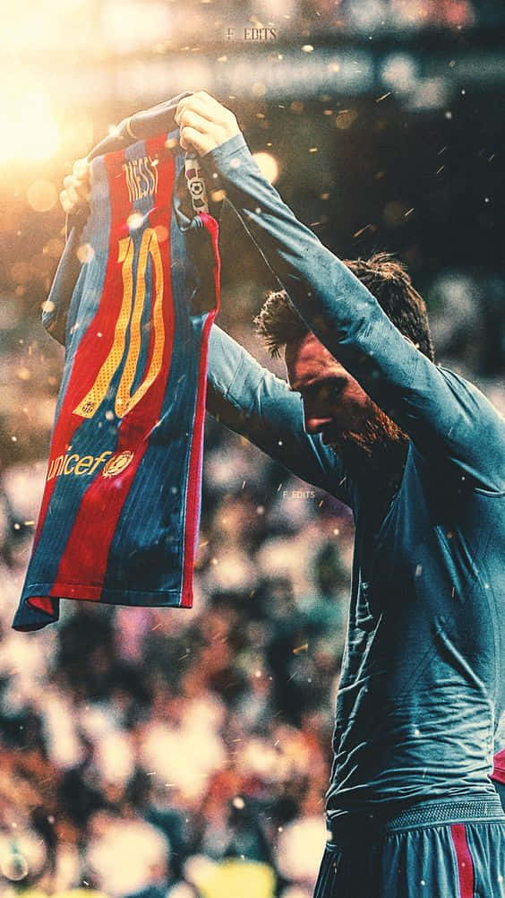 Messi Iphone Holding Up Jersey Background