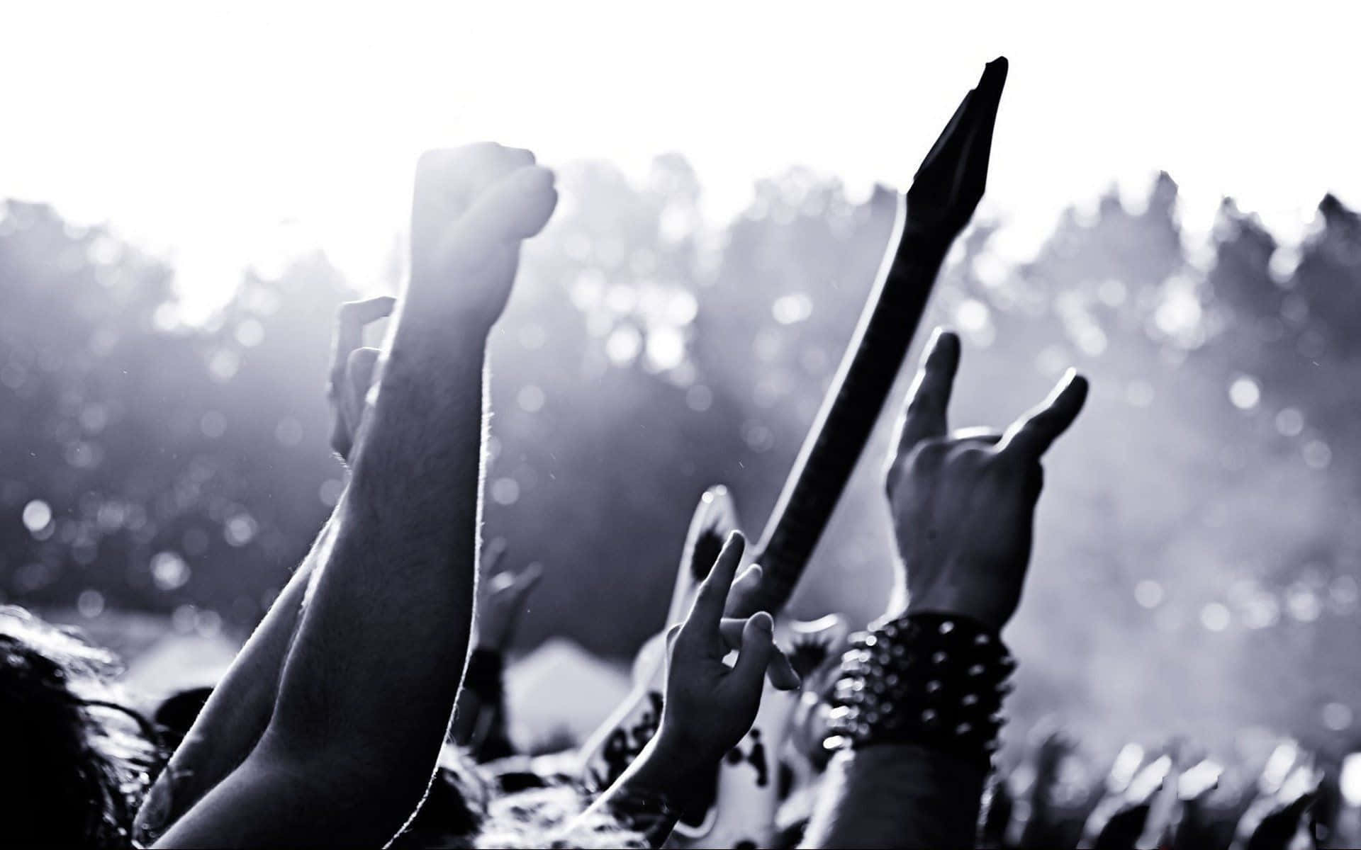 Metal Music Enthusiasts Unite To Create A Loud, Powerful Sound Background