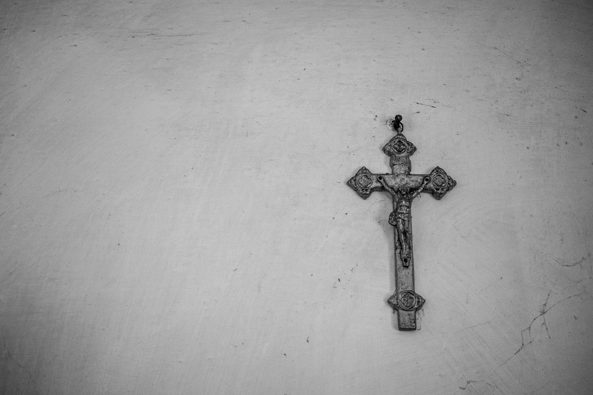 Metallic Jesus On Cross On A Wall