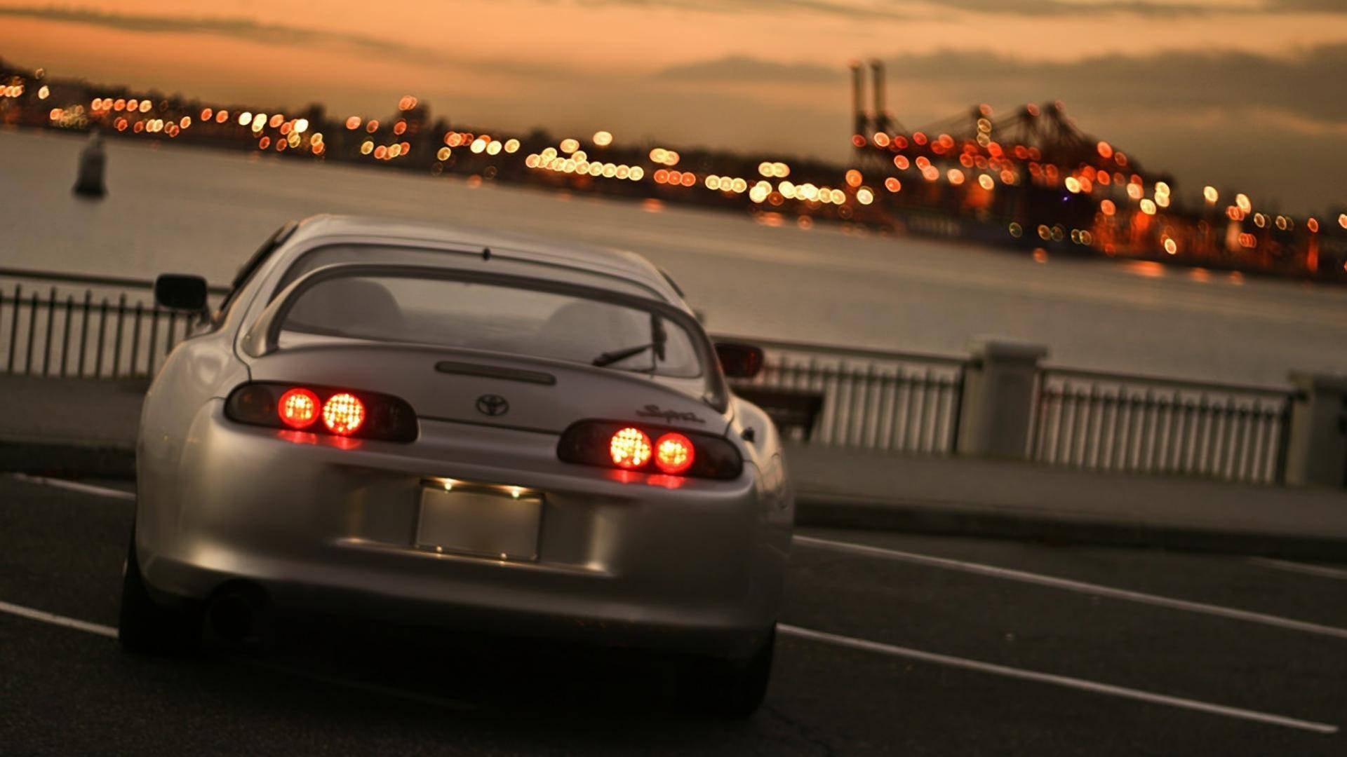 Metallic Silver Toyota Supra Mk4 By The Bay Background