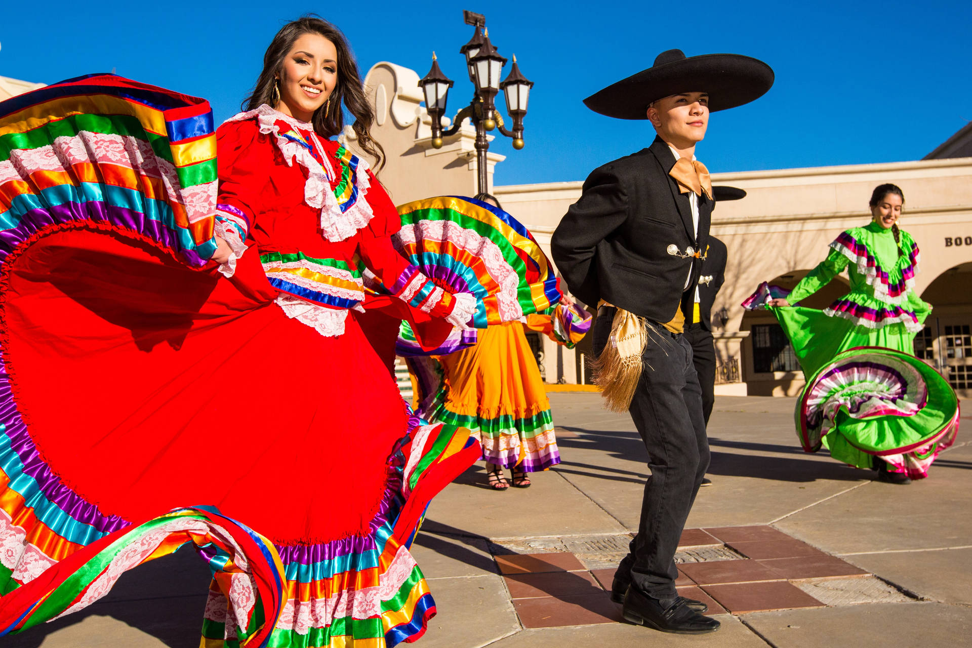 Mexican Man And Girl In Red Background