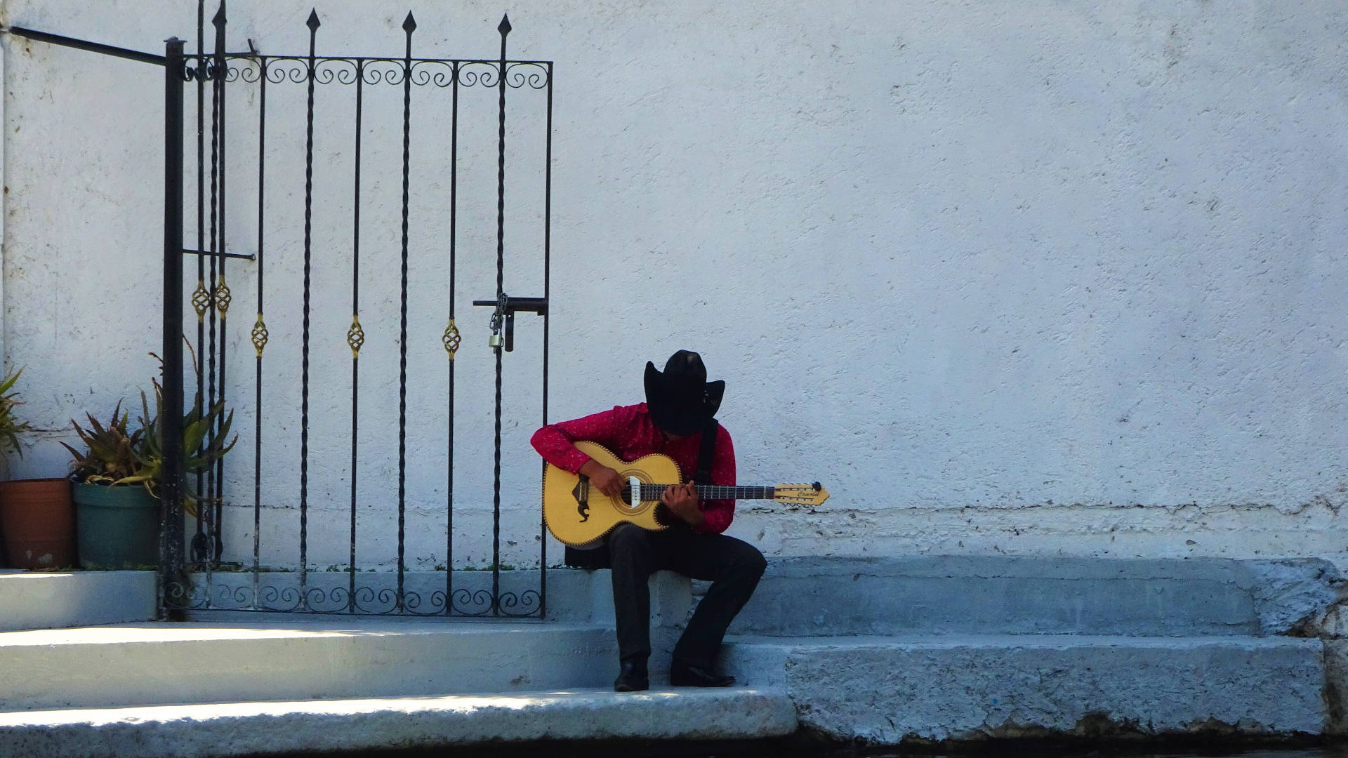 Mexican Man Playing Guitar Background