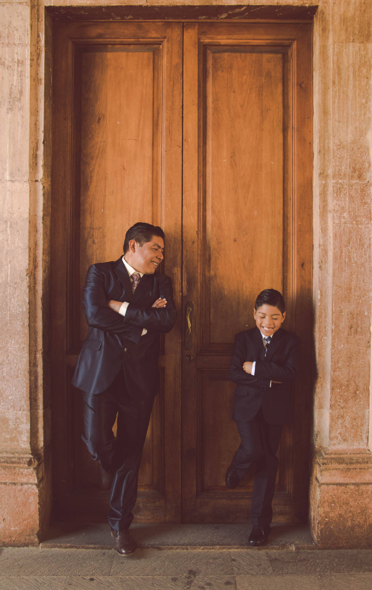 Mexican Man Standing With Child Background