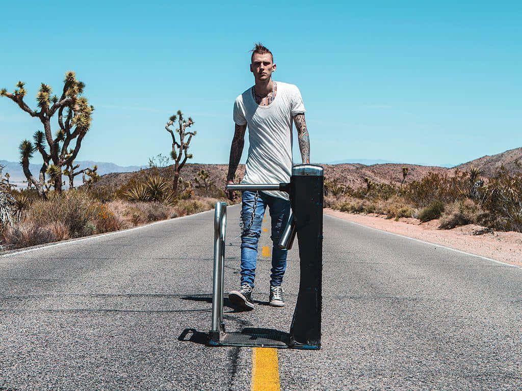Mgk Standing On The Road Background