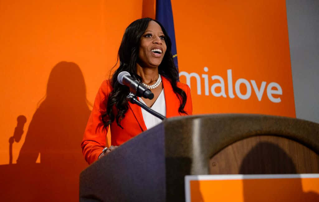 Mia Love With Orange Logo Background