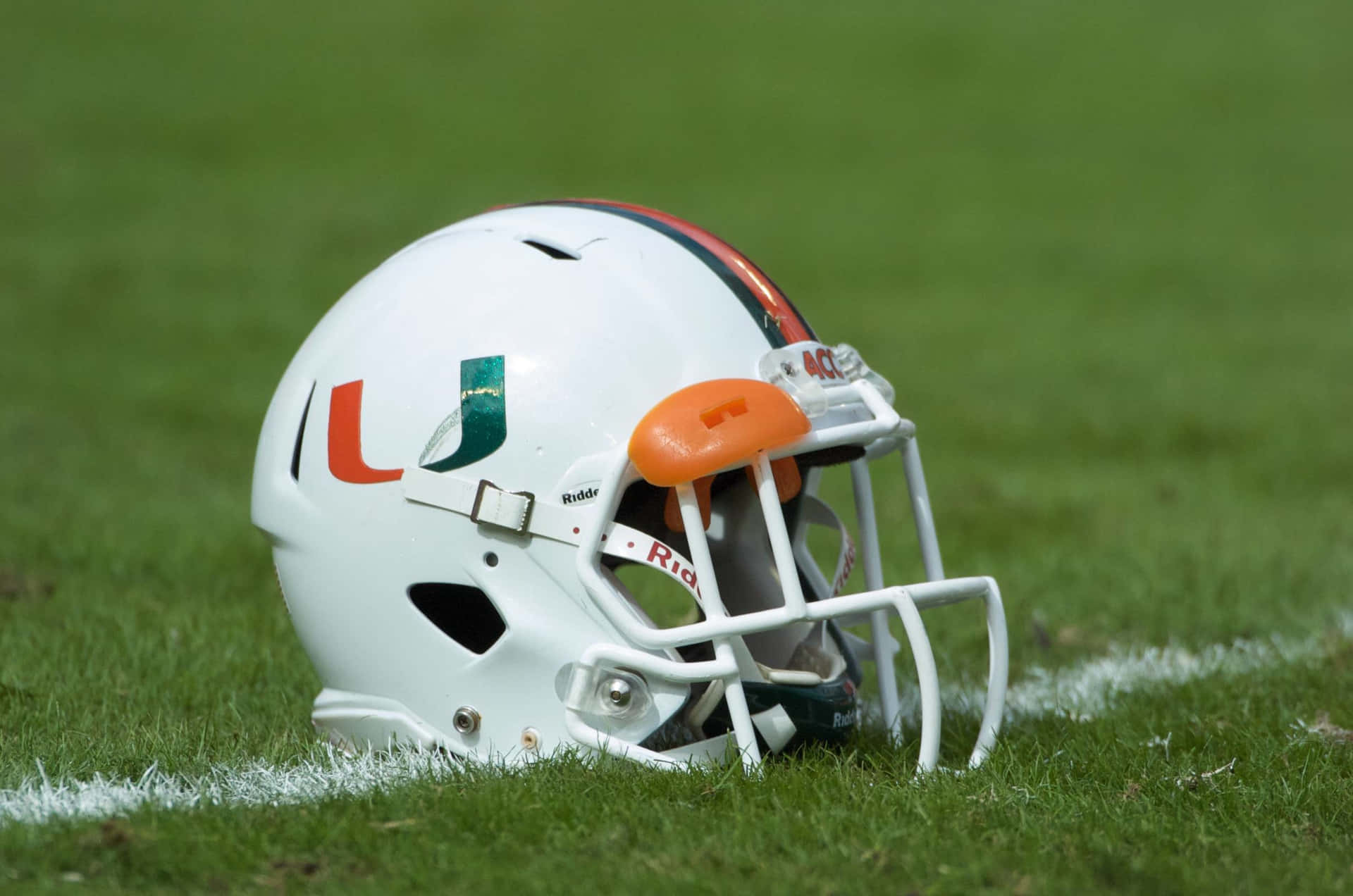 Miami Hurricanes Helmet On Field Background