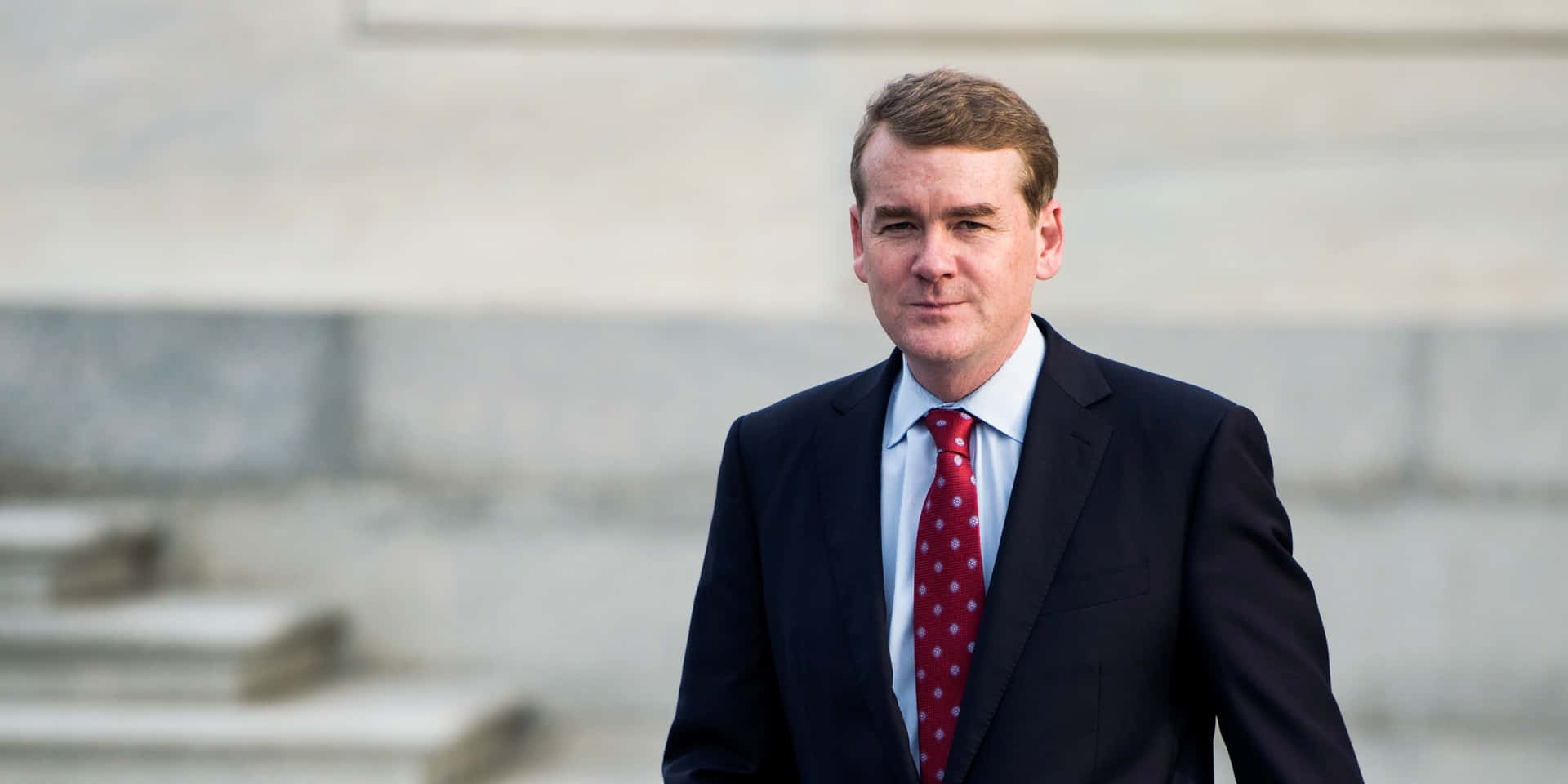 Michael Bennet Donning Suit Background