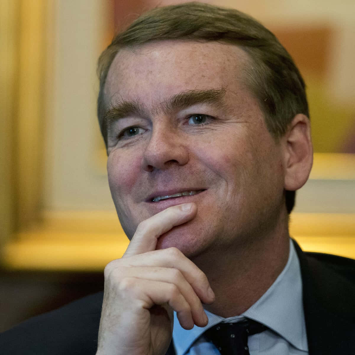 Michael Bennet Fingers On Chin Background