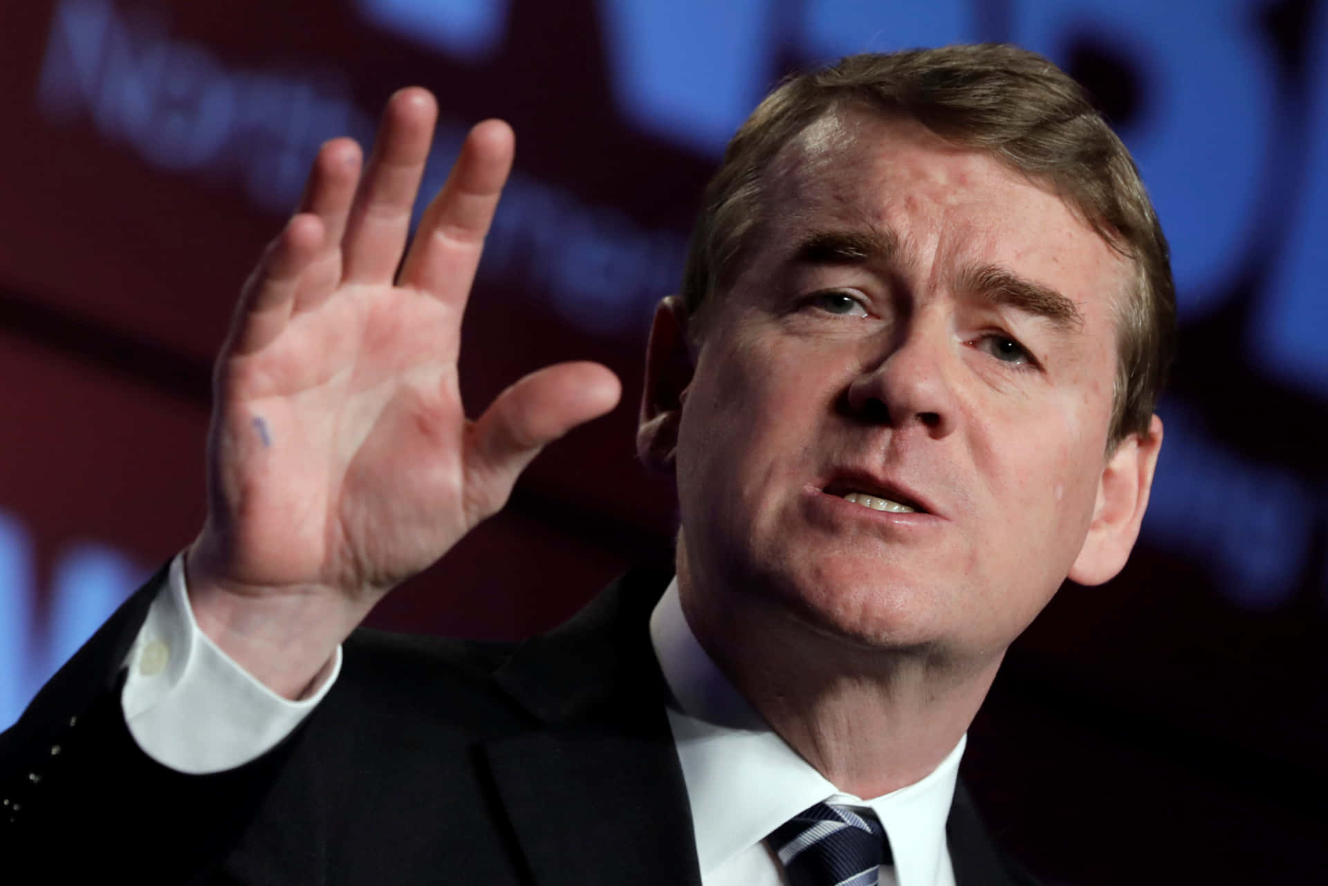 Michael Bennet Hand Raised Background