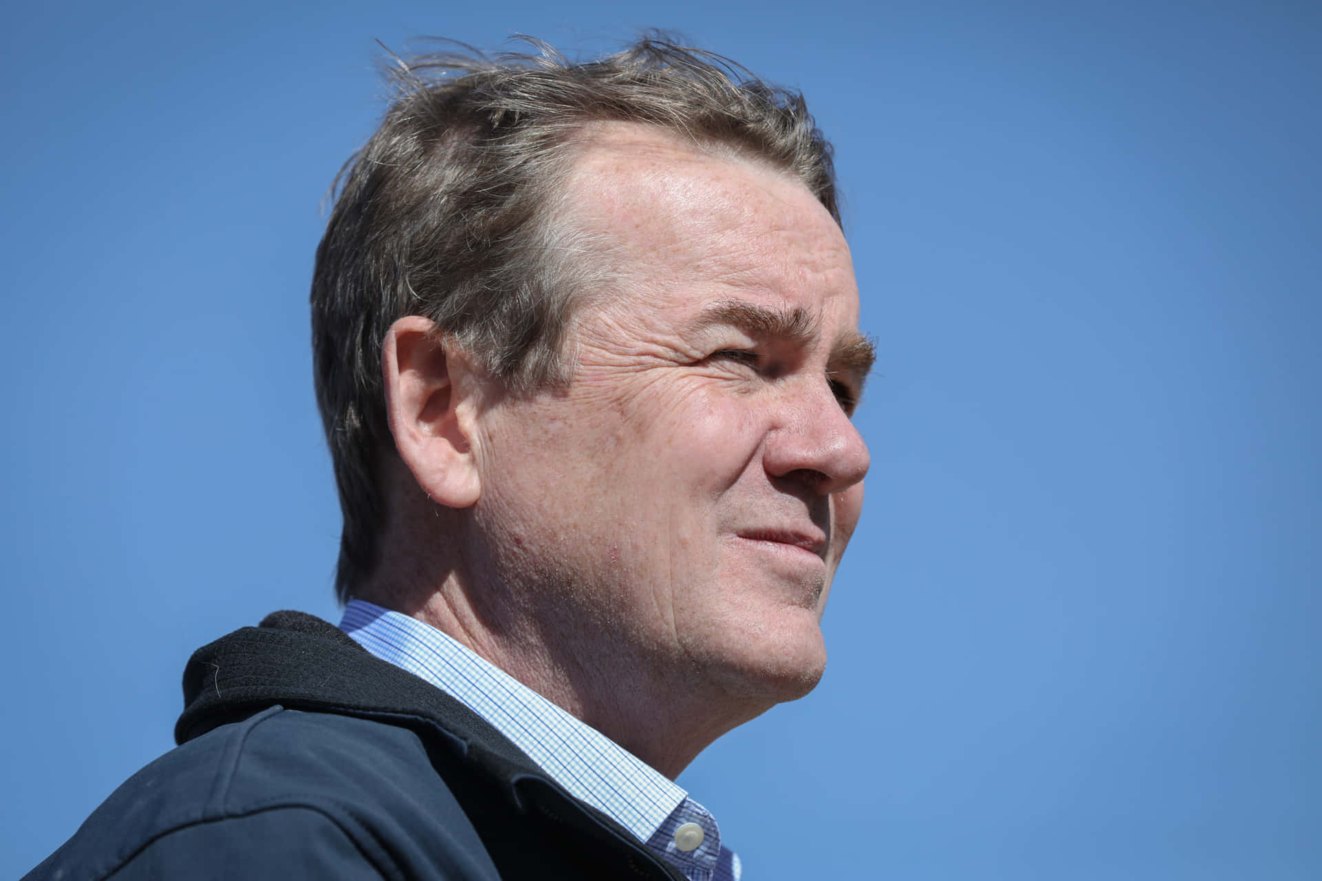 Michael Bennet Squinting To The Future Background