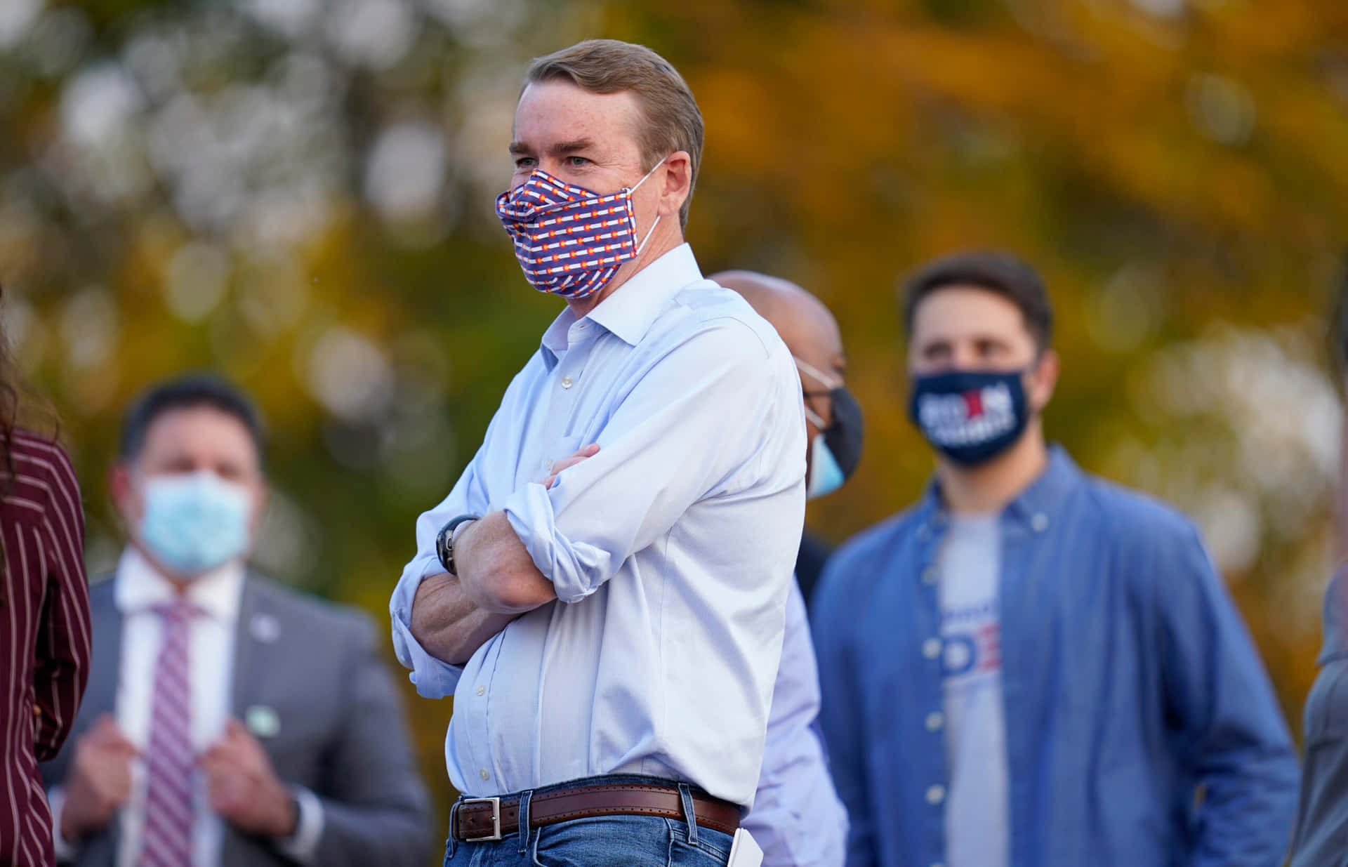 Michael Bennet Wearing A Mask Background