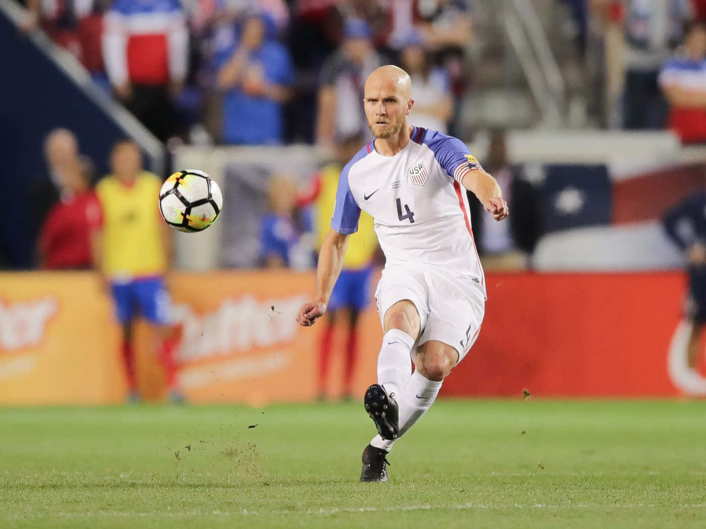 Michael Bradley Kicks Soccer Ball Background