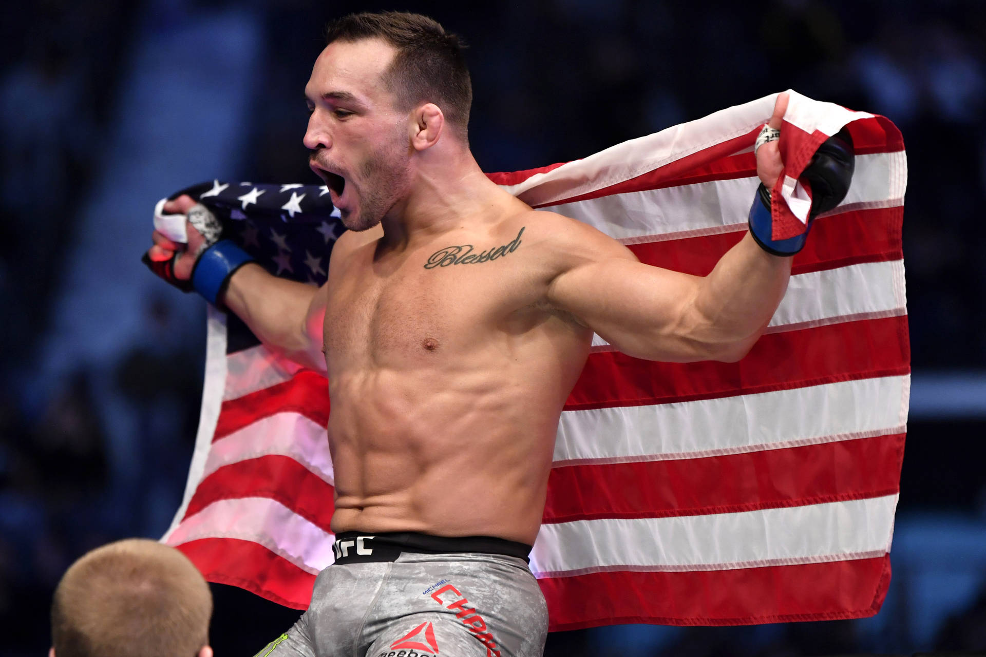 Michael Chandler Holding Flag Behind Back Background